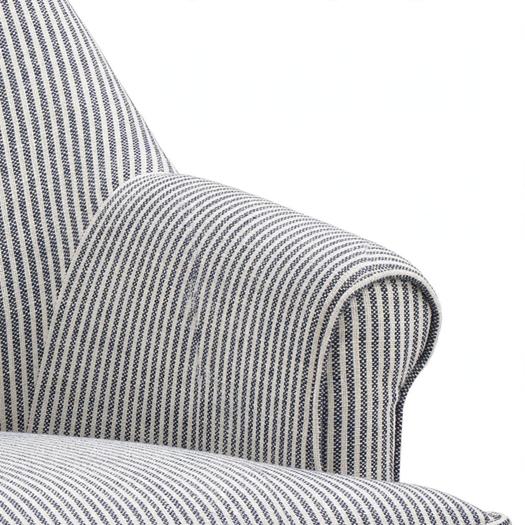 Pinstripe upholstery and rolled armrest detail